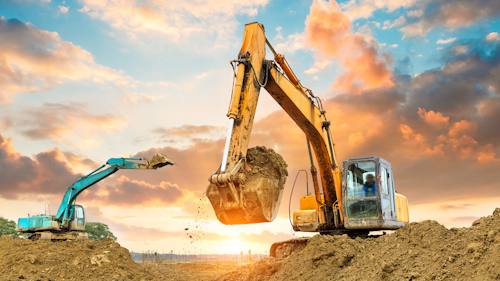 Outdoor setting with heavy equipment against a cloud background